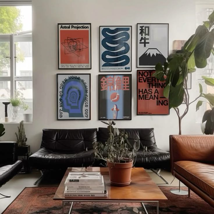 Black sofa, framed graphic posters, greenery, and a zebra rug